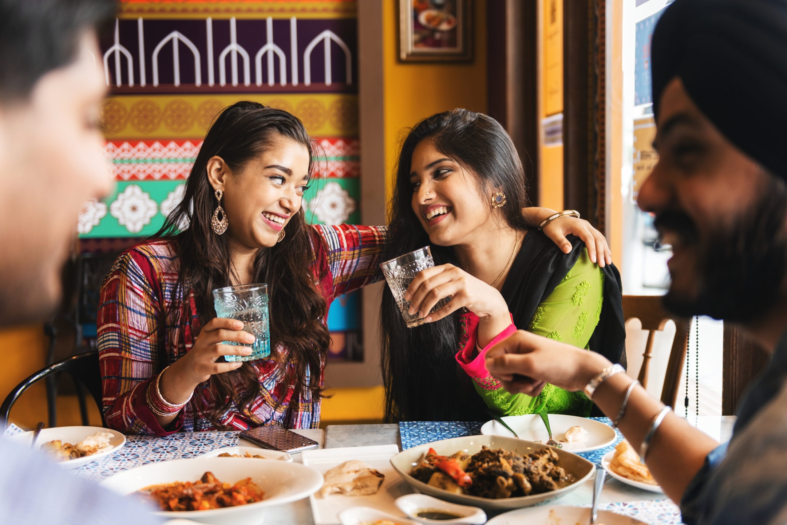 Friends enjoying a meal together at one of the Best Food Joints in Gurgaon at The Vensej Mall