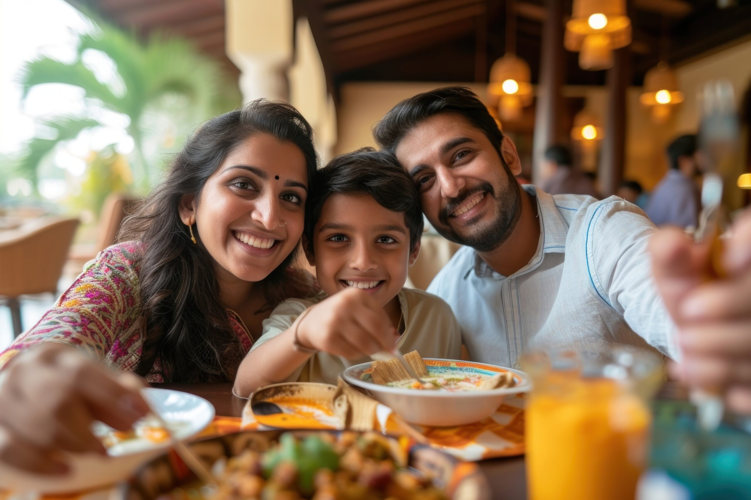Family enjoying food together at the best mall in Gurgaon for families during a happy outing