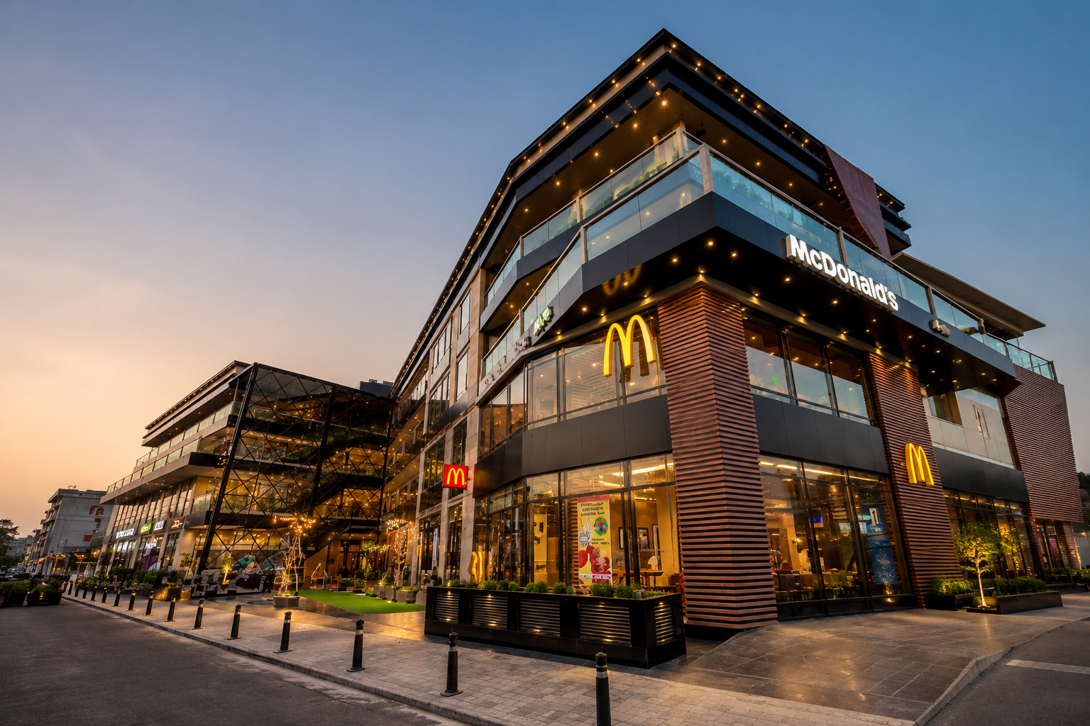 Modern exterior view of The Vensej Mall in Gurgaon featuring family-friendly dining, shopping, and entertainment spaces during evening hours – best mall in Gurgaon for families.